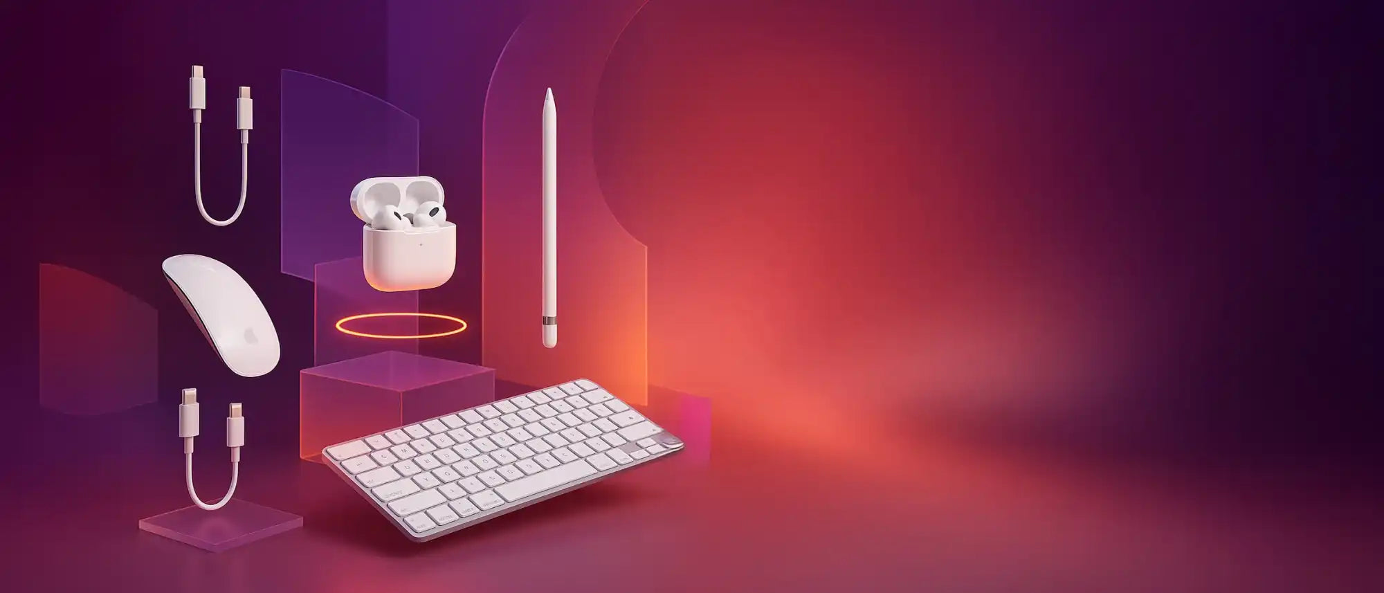 Een verzameling witte Apple-accessoires, waaronder een muis, oortjes, potlood, toetsenbord en oplaadkabels.